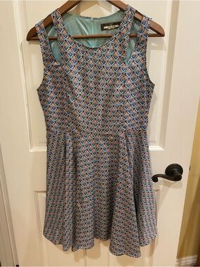 Boutique sleeveless mini dress with flouncy skirt, women’s M/L